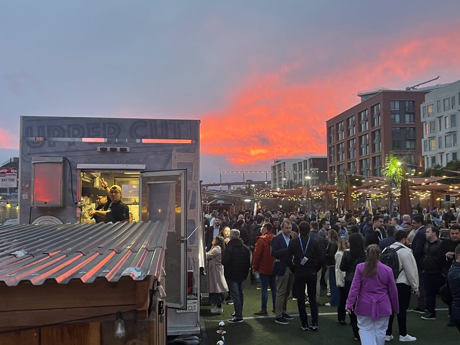 UpperCut food truck serving guests at Spark Social SF under a vivid sunset sky