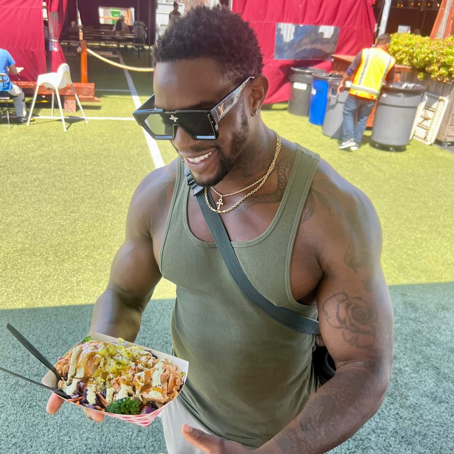 Happy guests enjoying UpperCut food truck bowls and sliders at Spark Social San Francisco